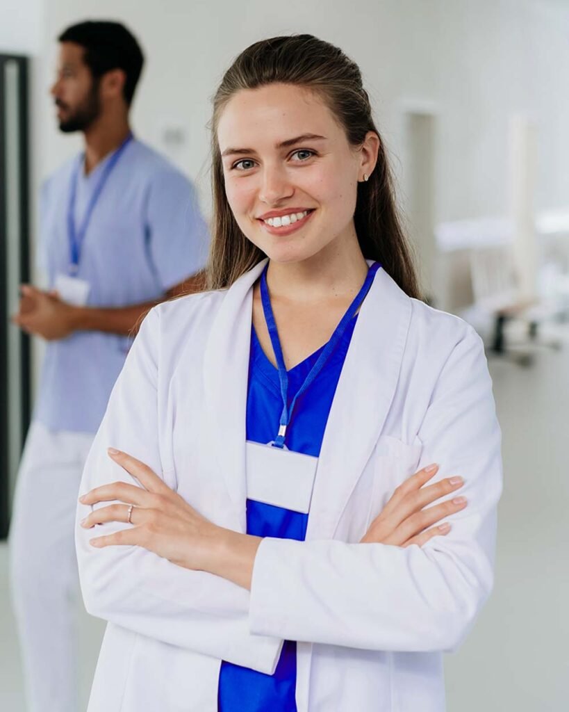 portrait of young woman doctor at hospital corrido2 F8RCC4T